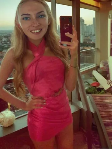 the lady in the pink dress has her cellphone,scuffed,leech,web cam,payola,hotel room,pink glasses