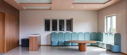 international kids school reception area n waitng area ,this room has some kind of blue bench on it,examination room,doctor's room,treatment room,therapy room,hospitalier,consulting room,hospital ward