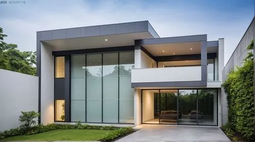 the front of a modern house in white,modern house,modern architecture,contemporary,cube house,modern style,luxury home,luxury property,residential house,glass facade,frame house,cubic house,beautiful 