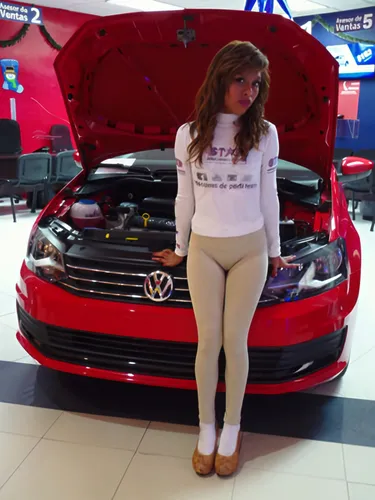 the woman is posing in front of a car,carbossiterapia,autoshow,car model,sportcombi,auto show,maruti