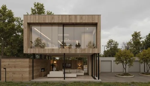 A modern, minimalist house with a contemporary design, located in the middle of a grassy area with trees in the background. the house is a two-story structure with a wooden exterior and large glass wi
