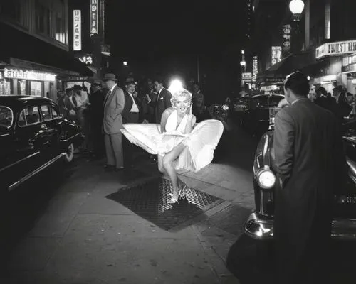 A bustling 1950s city street at night, filled with a mixture of excitement and curiosity as a film crew captures a glamorous scene. Behind the iconic shot, large film cameras on tripods are manned by 