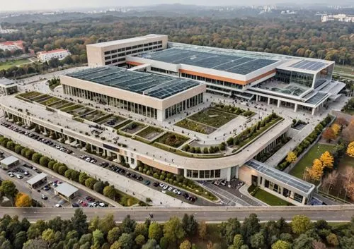 Mall TIPO MODERNO FUTURISTA,a large building sitting above trees and road,home of apple,sanatoriums,headquarter,data center,new building,modern office,biotechnology research institute,office building,