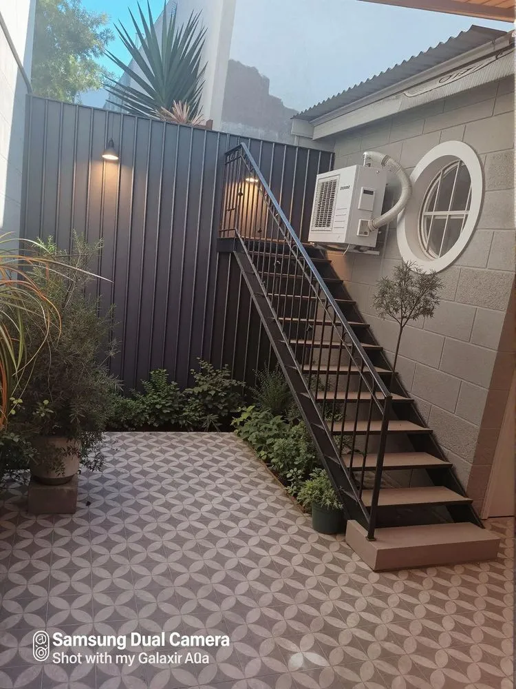 a staircase with stairs near a building