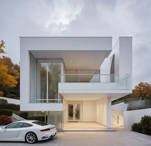 a car parked in front of a modern house,modern house,modern architecture,cube house,driveway,modern style,cubic house,Photography,General,Realistic