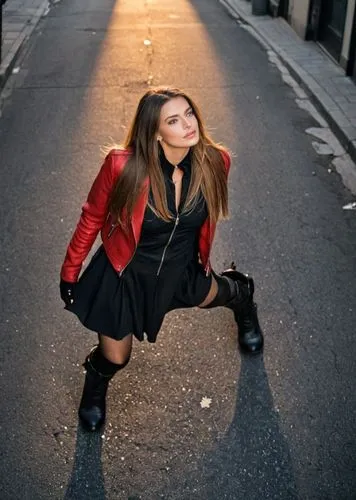 A striking full-body photograph of a beautiful 23-year-old Caucasian woman, with long brown hair cascading to her shoulders, dressed in a black dress with a neckline and a bold red leather jacket, com