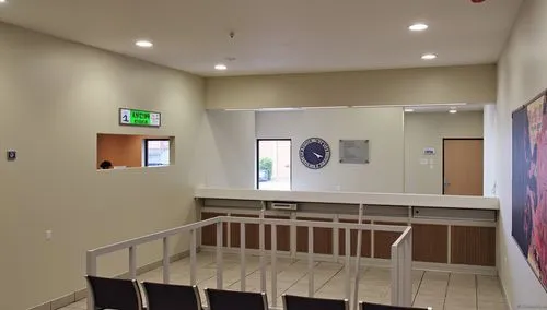the waiting room has chairs at the front of it,foyer,wall completion,conference room,hallway space,treatment room,entryway,periodontist,therapy room,therapy center,collaboratory,lobby,contemporary dec