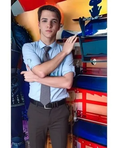 the young man in a tie has his arms crossed,tie,principal,cute tie,necktie,real estate agent,binder,business man,sales man,collection of ties,academic,bacchanalian,twink,vocational,secretary,professio