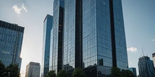 a cityscape shows tall buildings and trees,international towers,glass facade,glass building,office buildings,glass facades,tall buildings,high-rise building,skyscrapers,the skyscraper,skyscraper,resid
