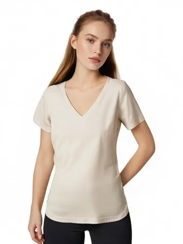a woman wearing black and white poses for the camera,girl in t-shirt,women's clothing,girl on a white background,ladies clothes,women clothes,cotton top,dolman,fir tops,undershirts,female model,women'