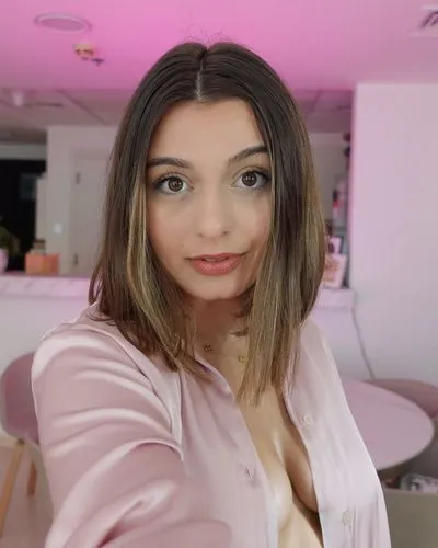 Naked woman age 35,a woman taking a selfie wearing a pink top,pink background,petite,pink beauty,pink tie,makeup,pink,striped background,purple background,pink glazed,mauve,put on makeup,uploading,fil