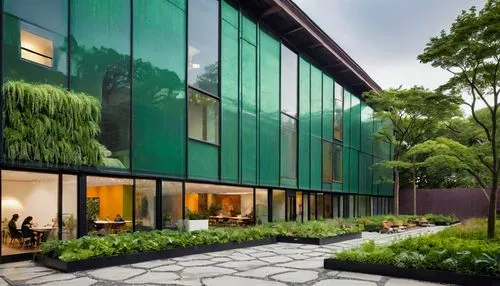 Photo of a vibrant visual arts center, showcasing eco-friendly architecture with green roofs, solar panels, and lush living walls... The building has an open, minimalist design, with abundant natural 