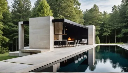 An ethereal photograph, A detailed, serene oil painting. Pool house exterior.  Dark black wood and white travertine stone. Long Fireplace on the far big wall. Forest behind.,a dining room table with c