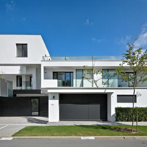 Vivienda unifamiliar en dos niveles a media altura , arquitectura minimalista en colores claros,this modern architecture house is very white with windows,modern house,cube house,modern architecture,du