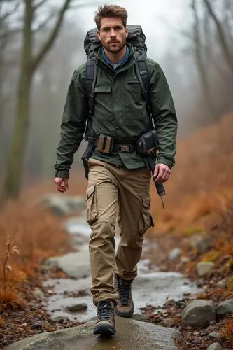 An adventurous fall look with a windbreaker, cargo pants, and trail running shoes. He’s hiking up a rocky path, with a backpack and utility belt, perfect for outdoor exploration in crisp autumn weathe