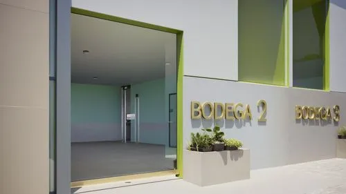 “Vista detallada de la entrada de la ‘Bodega 2’ en un complejo industrial moderno. La entrada cuenta con una puerta doble de cristal con tiradores metálicos minimalistas, que permite visibilidad hacia