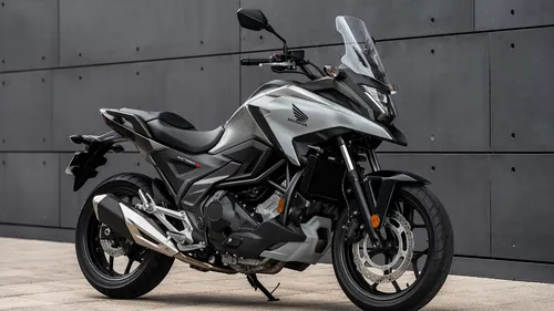 Honda NC750x, production year 2023
,a motorcycle parked in front of a wall,electric motorcycle,e bike,moped,990 adventure r,electric scooter,motor scooter,type 6500,seat dragon,electric mobility,motor