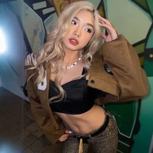 the beautiful blond woman is posing in front of a mural,gyaru,jordyn,nari,teya,tana,natashquan,joo,yubin,korean,hyoon,chae,nunu,gabsi,chonnam,abs,azn,asami,brielle,cacia,zhaowen