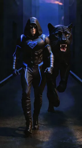 In a dark alley illuminated by electric blue neon lights, a hooded warrior in a black tactical suit with glowing accents walks slowly toward the camera. Beside him, a black panther moves in perfect sy