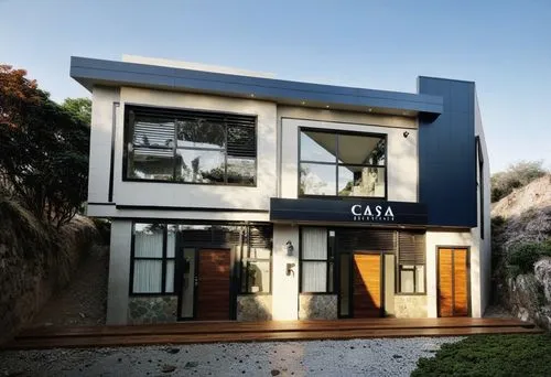 a couple of doors on the side of a house,modern house,fresnaye,casita,cubic house,dunes house,modern architecture,cube house,contemporary,villa,frame house,casabella,two story house,mid century house,