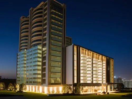 a modern office building illuminated up at night,zorlu,rotana,cyberjaya,noida,umhlanga,mgimo,escala,residential tower,lodha,evagora,Photography,General,Realistic
