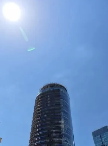 Handsome architect boy explains the redesign of the skyscraper facade in a parametric style and the art is complete with the boy explaining the facade. Iranian Islamic architectural patterns are repea