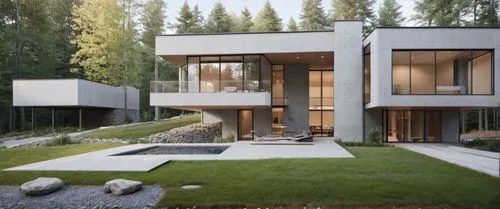the contemporary home is nestled into a hillside,modern house,modern architecture,forest house,cubic house,house in the forest,dunes house,landscaped,render,contemporary,residential house,luxury prope