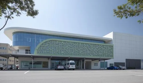 
a medical facility,a truck sitting in front of a building near other cars,medibank,shenzhen vocational college,medical center,polyclinic,phototherapeutics,fidm,metaldyne,multistoreyed,ucsf,biotechnol