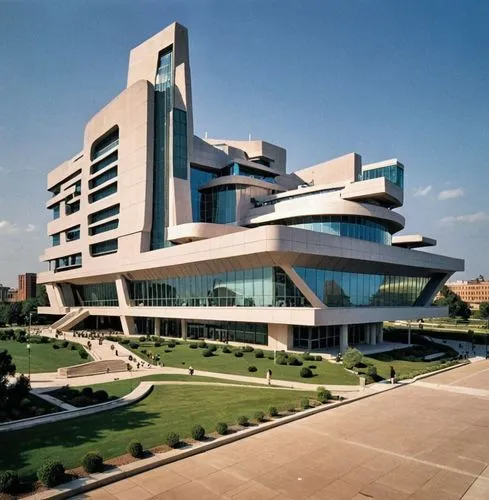 MUSEUM COLOR MODERN FUTURIST,a modern building with some green grass in front,biotechnology research institute,university library,new city hall,supreme administrative court,university hospital,new bui