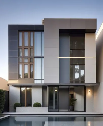 a pool sits in front of an elegant building,modern house,modern architecture,cubic house,cube house,modern style,contemporary,glass facade,fresnaye,dunes house,louver,dreamhouse,house shape,architectu