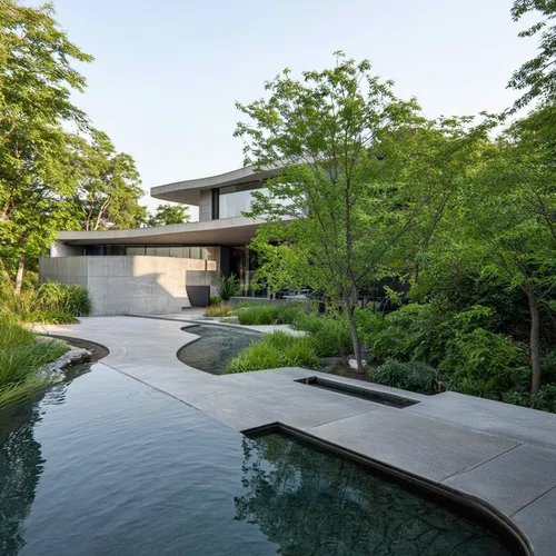1Building,this modern house has an interesting pool and water feature,landscape design sydney,landscape designers sydney,landscaped,pool house,bridgehampton,modern house