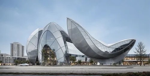 some very cool looking buildings with large windows,steel sculpture,morphosis,futuristic architecture,yekaterinburg,futuristic art museum,heatherwick,ekaterinburg,high heeled shoe,harbin,triforium