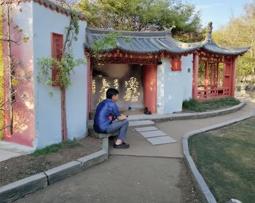 Китайский павильон,a man kneeling down in front of a red and white building,hall of supreme harmony,summer palace,white temple,ashram,spiritual environment,wishing well