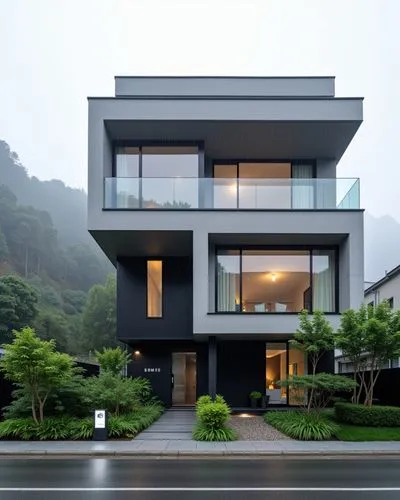 front view of the new zeland style modern minimalistic  concrete hotel with plants, foggy rainy scene, view from the road 
,modern home designed with black and white siding,modern house,modern archite