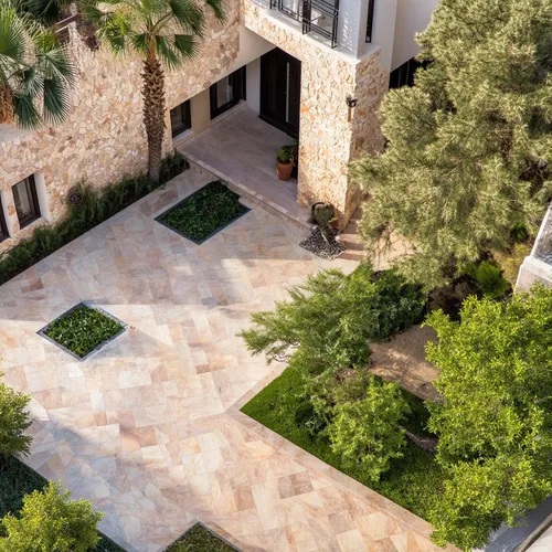 a classic courtyard villas, sustainable modern design in the middle eastern region aerial view,this is a courtyard looking down on a beautiful home,landscaped,courtyards,driveways,garden elevation,fla