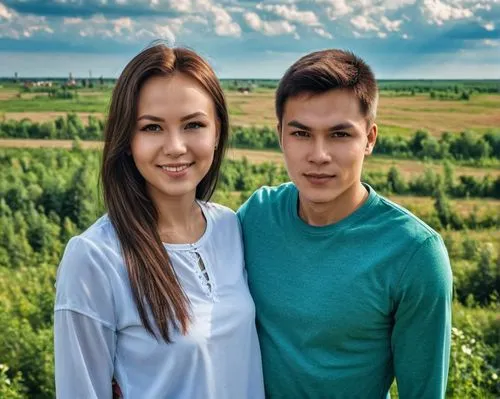 A young couplefrom Russia (Tatarstan), 25 years old, poses for a family portrait,two people are posing for a picture in a grassy field,kazakh,young couple,sarbayev,jinglian,lakorn,kalmykia,Photography
