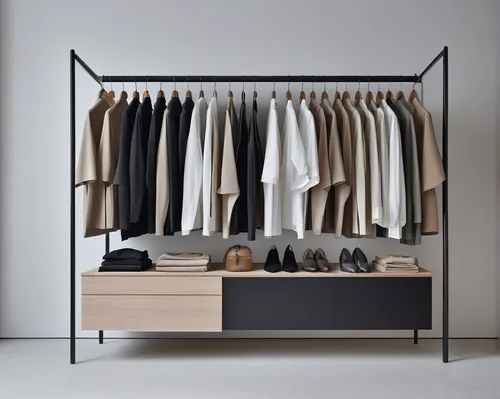 Imagine a minimalist wardrobe with a sleek, neutral color scheme.,walk-in closet,garment racks,wardrobe,clotheshorse,room divider,closet,dressing table,shelving,women's closet,dresser,chiffonier,armoi