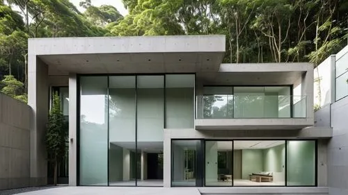 a home with a large glass sliding door,cubic house,modern house,modern architecture,mirror house,cantilevered,exposed concrete,cube house,glass facade,dunes house,frame house,cantilevers,contemporary,