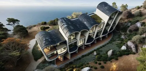this is an aerial view of a modern architecture on a cliff,dunes house,beach house,house by the water,house with lake,island church,house in mountains,house in the mountains,large home,house of the se