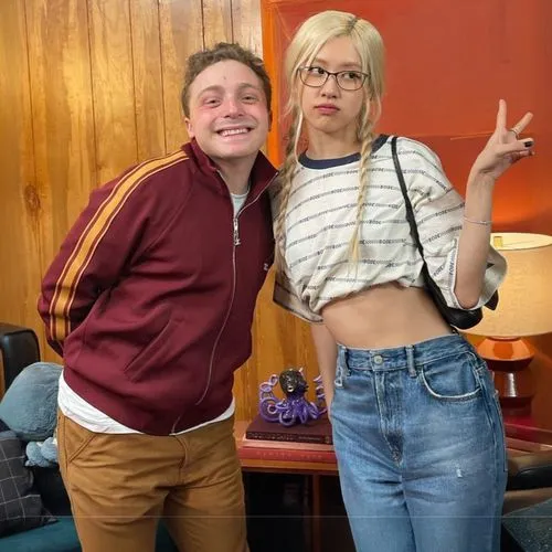 a man and woman in jeans posing for a po,midriff,abs,bellybuttons,tummy,vegan icons,fab,midriffs,icons,nips,outfits,singer and actress,bellybutton,sustainability icons,bicentennials,mini,crop top,mom 