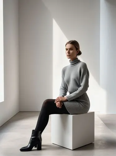 Photorealistic contemporary art gallery scene with a minimalist performance-art atmosphere.
A stylish young woman with a calm, confident presence sits elegantly on a modern lightweight metal chair pla