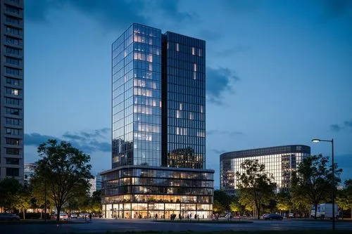some buildings are lit up in the evening,residential tower,renaissance tower,glass facade,penthouses,condos,high-rise building,urban towers,high rise building,glass building,the energy tower,inlet pla