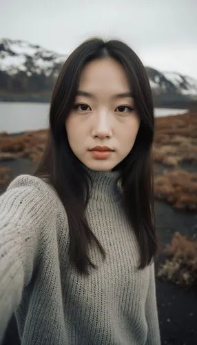 beautiful girl, selfie, knit top, landscape in iceland, winter vegetation, volcanic landscape, an ultra fine and detailed abstract photoshoot of an Editorial extreme close-up shot,a woman that is stan