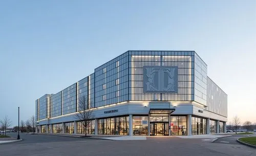 a factory architecture, silver grey glass, aluminium cladding, ultra detail, eye side view, high tech, no error, clear details, outlet mall interior,a tall modern building is lit up with street lights