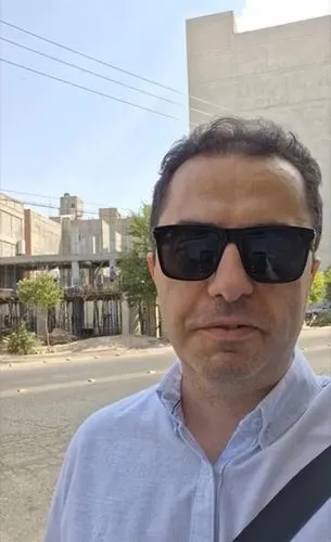 While the boy is talking calmly to the camera, the building behind him is completed in 5 floors. Gradually it becomes a modern building with large windows and recesses and protrusions in the facade an