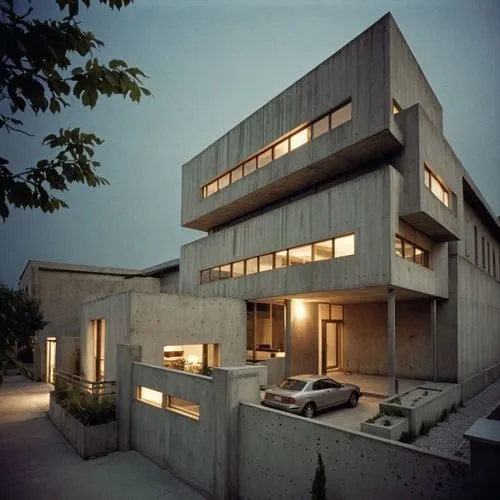 an image of a house at night with lights on,habitat 67,modern architecture,cubic house,modern house,dunes house,cube house,contemporary,residential house,concrete construction,exposed concrete,concret