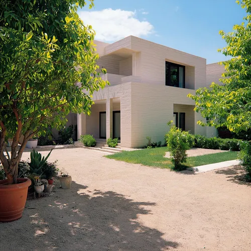 a classic courtyard villas, sustainable modern design in the middle eastern region,a house in the middle of a graveled area,dunes house,modern house,holiday villa,kibbutzim,residential house,private h