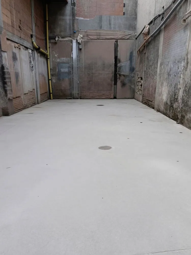 an empty room in a dirty building is shown