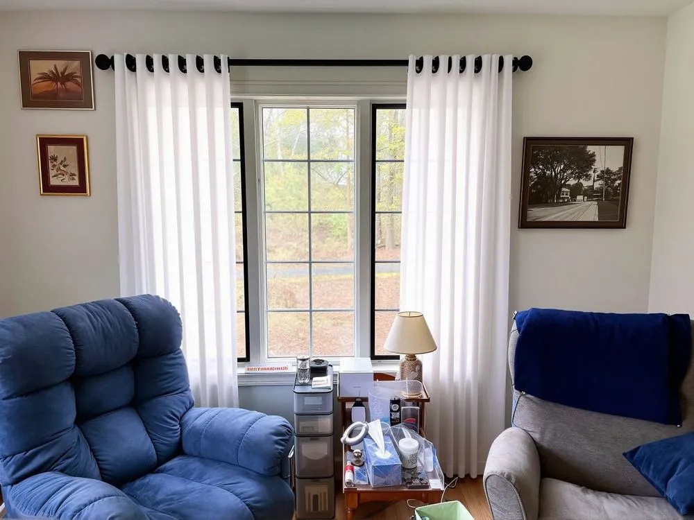 a chair and sofa in a small living room