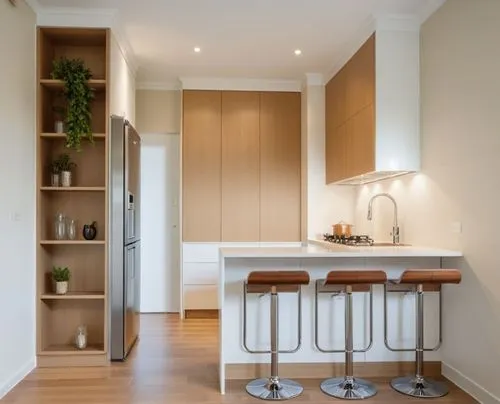 A modern and stylish kitchen featuring a combination of cream MDF and wood, creating a warm and inviting atmosphere. On the right side, there is a double-bowl sink along with a built-in cooktop, while